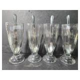 Four sundea cups and spoons