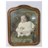 Old baby photo in antique frame