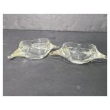 Two uniquely shaped glass dishes