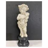 Carved sea cherub statue