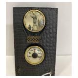 Old leather thermometer and key holder