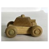 Small handcrafted wooden army tank toy