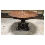 Antique solid wood table on caster wheels