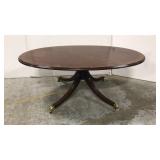 Oval wood coffee table on caster wheels