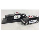 2 model police vehicles