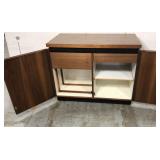 Rolling hidden bar cabinet