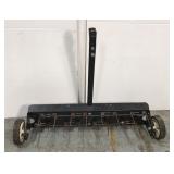 Pull behind lawn dethatcher rake