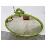 Ornate oval wall mirror