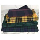 Four pieces of plaid fabric
