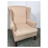 Pink plaid wing back chair