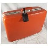 Vintage orange suitcase
