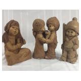 Trio of vintage clay children