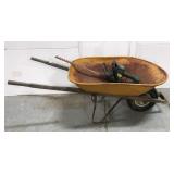 Wheelbarrow and electric hedge trimmer