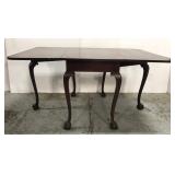 Antique clawfoot drop leaf table