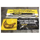 Two Monroe Shocks garage banners