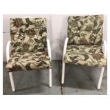 Two patio chairs with cushions