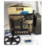 Bell and Howell 8 mm projector with extras