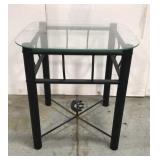 Metal patio table with glass top