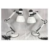 Two metal articulating desk lamps