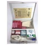 Loaded vintage first aid kit