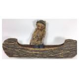 Bark canoe with old doll