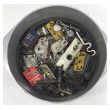 Assorted old hardware in metal pot