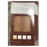 Box of interlocking plank flooring