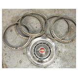 Old Chevy hubcap & five beauty rings