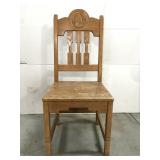 Oak carved horseshoe chair