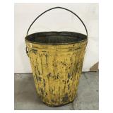Galvanized painted yellow trash can
