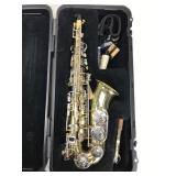 Selmer saxophone with case and accessories