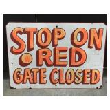 Vintage steel metal stop on red sign