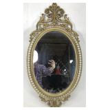 Ornate oval mirror