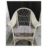 White wicker rocker with cushion