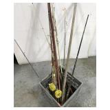 Fishing poles in milk crate
