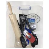 Tub of new kitchen utensils