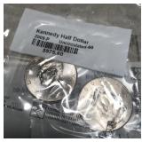 Two Kennedy half-dollar uncirculated coins