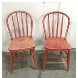 Pair of weathered red farm chairs
