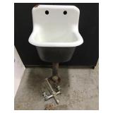 Vintage porcelain enamel sink with faucet