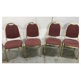 Set of four stacking metal chairs