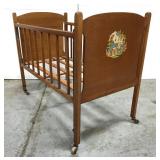 Vintage small doll crib on wheels