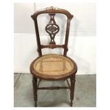 Antique carved cane seat chair
