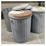 Trio of galvanized cans