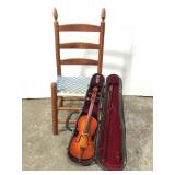 Miniature chair and violin