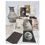 Ceramic vase and vintage photo box with photos
