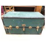 Antique green steamer trunk