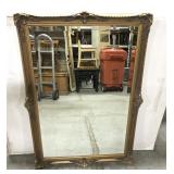 Ornate wood framed mirror