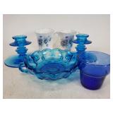 Blue glass candlestick holders and candy dish