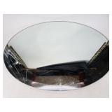 Oval unframed mirror
