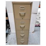 Locking file cabinet with key